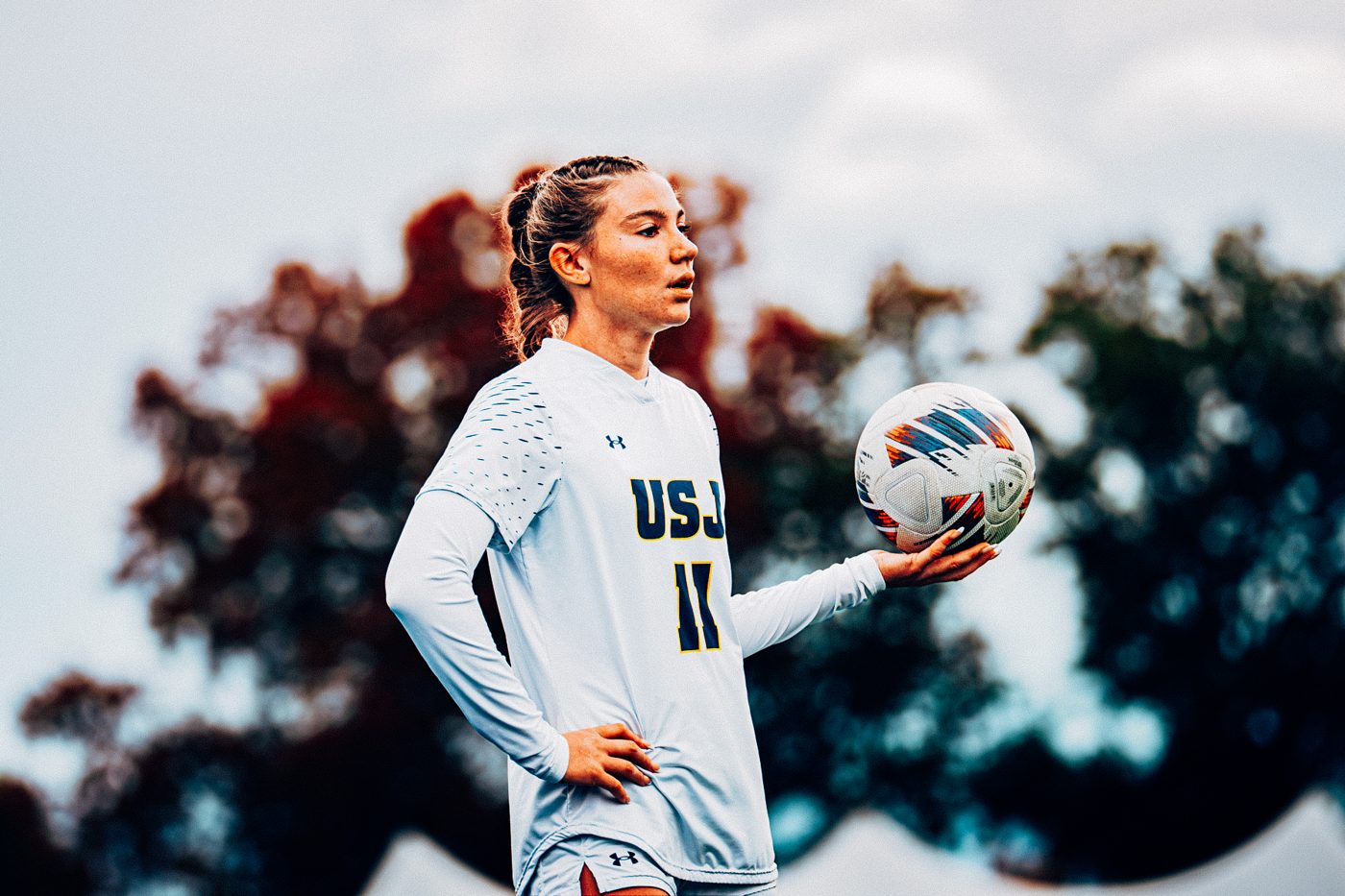 A soccer player holding a ball, with CAPRI